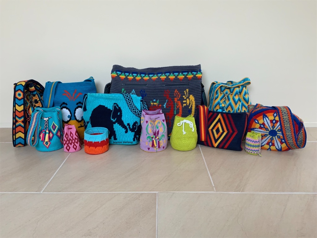 Collection of handmade crocheted bags by Marion Verloop.