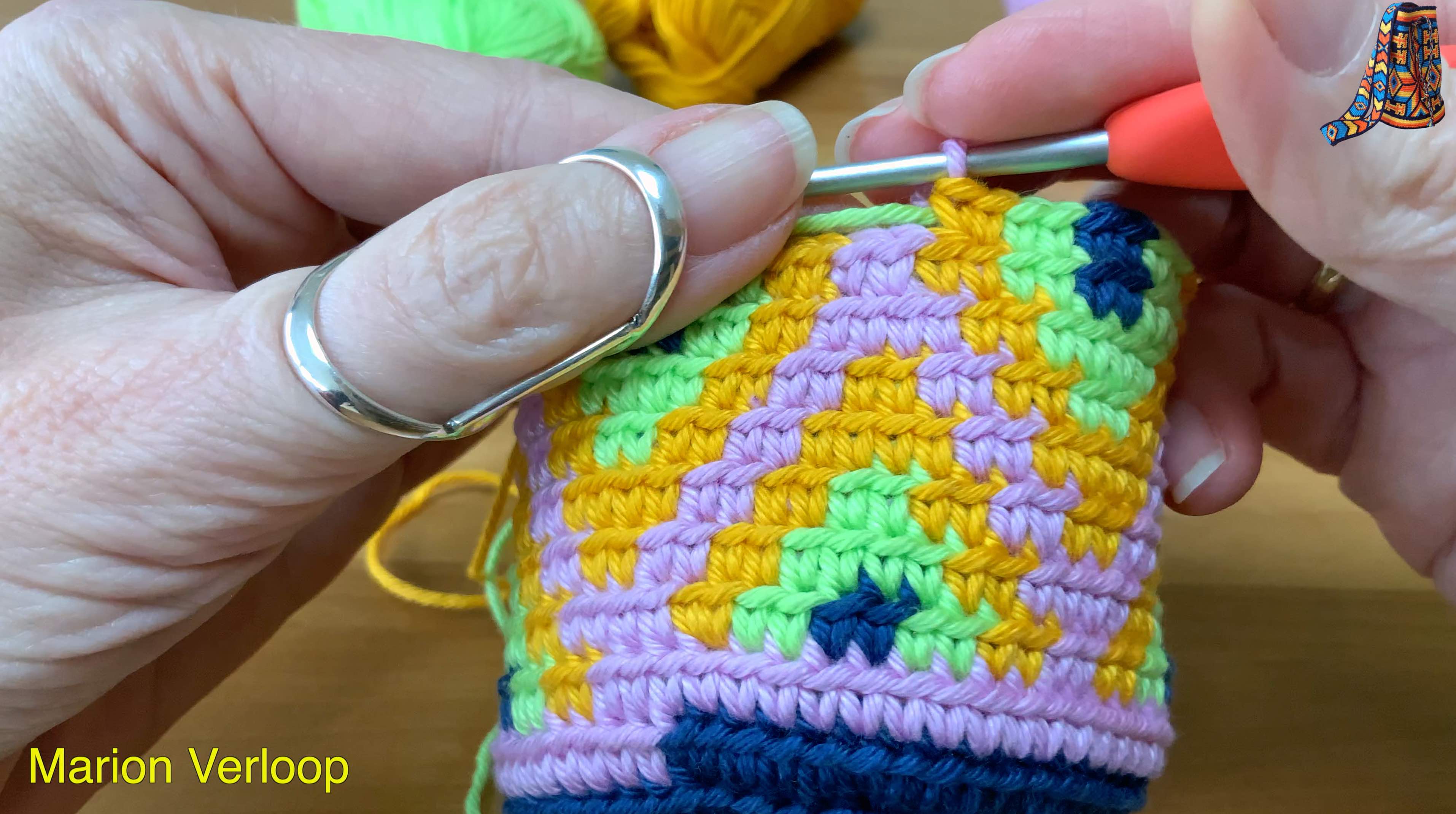Close-up of a Mochila crochet project demonstrating a technique to hide the ‘jog’ so the color change between spiral rounds is less visible.