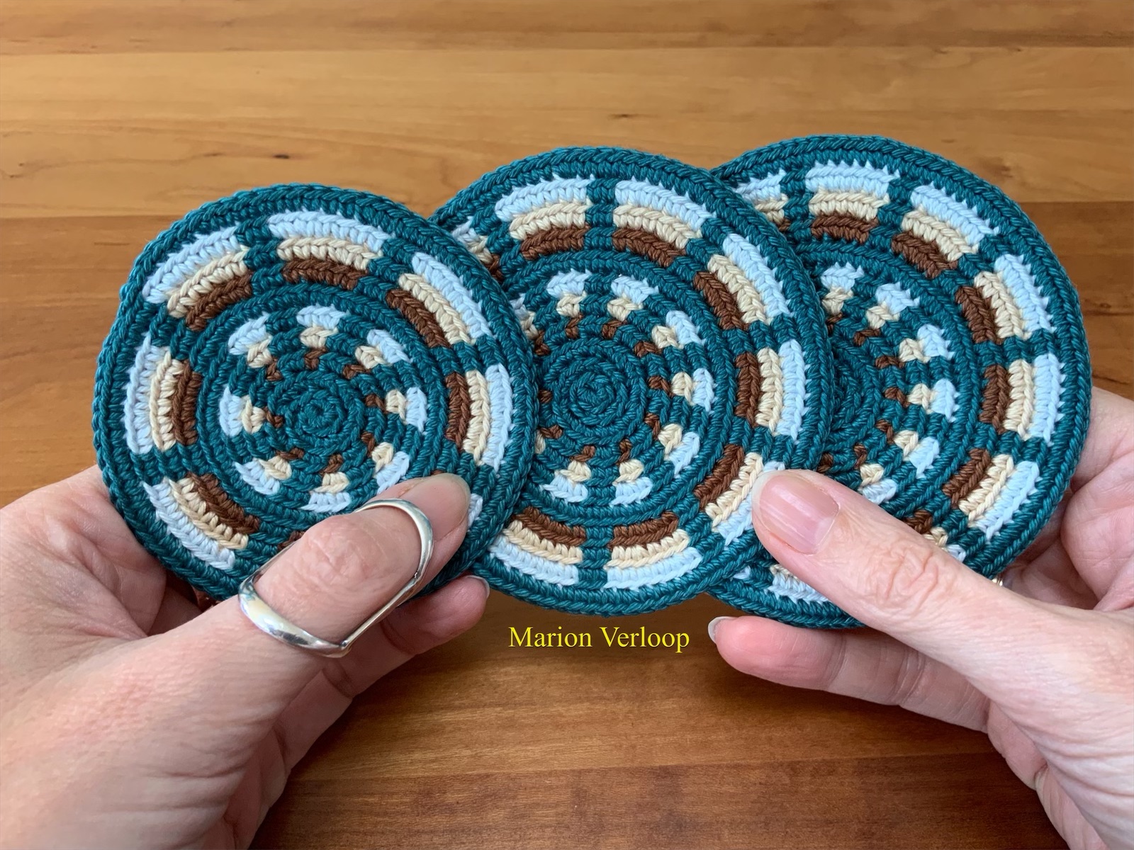 Three crocheted round Mochila bottoms side by side, each with a different number of increases per round (8, 10, and 12), illustrating the minimal difference in diameter.